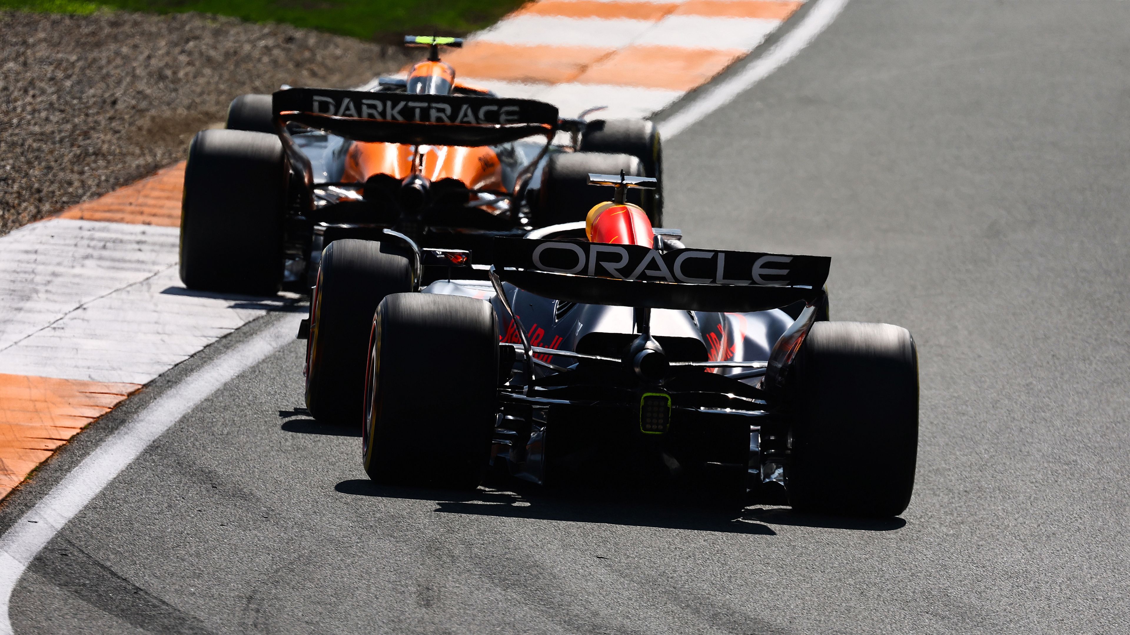 Max Verstappen of the Netherlands driving the (1) Oracle Red Bull Racing RB20 follows Lando Norris of Great Britain driving the (4) McLaren MCL38 Mercedes.