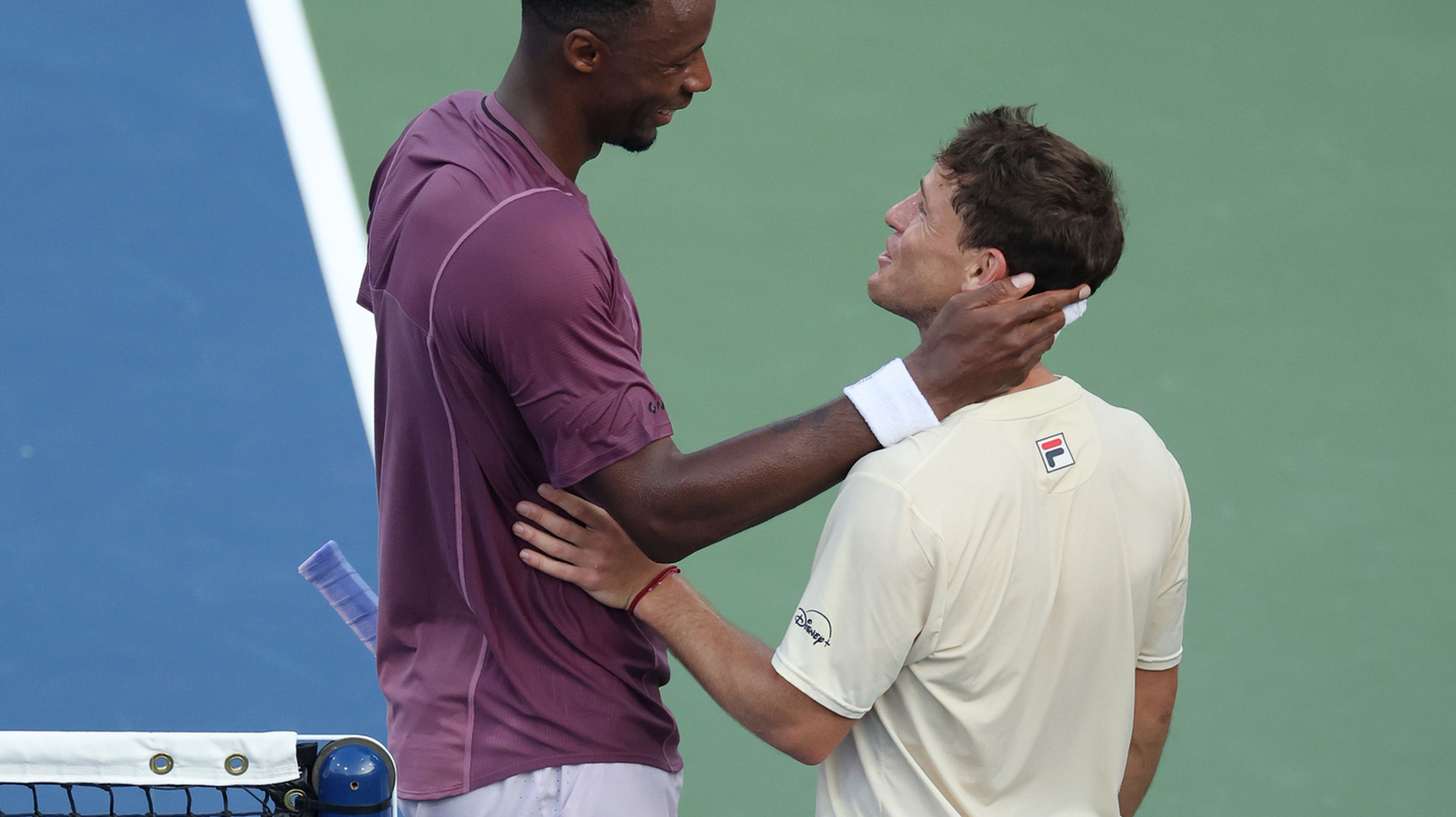 Gael Monfils of France talks with Diego Schwartzman of Argentina after their US Open clash.